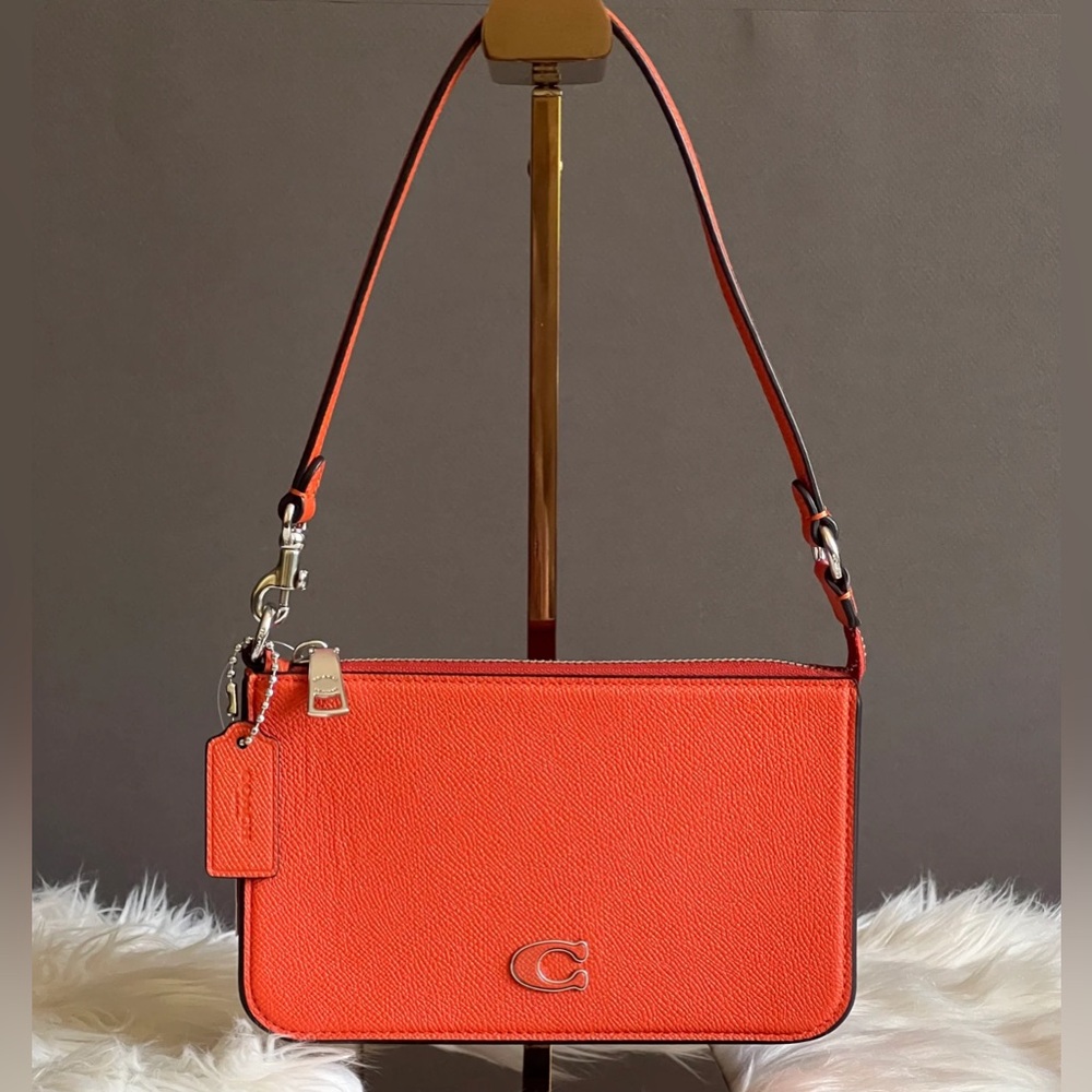 SOLD: COACH POUCH BAG WITH SIGNATURE CANVAS DETAIL